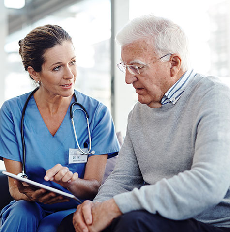 Senior patient meeting with his nurse about care